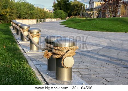 Green City Public Park For Walks And Entertainments With A Fence Made Of Rope And Bollards. The New 