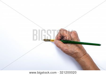 Senior Woman's Hand Painting With Paintbrush Isolated On White Background