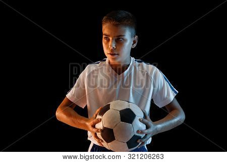Young Boy As A Soccer Or Football Player In Sportwear Making A Feint Or A Kick With The Ball For A G