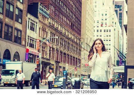 Young Eastern European Businesswoman Traveling, Working In New York, Holding Laptop Computer, Callin