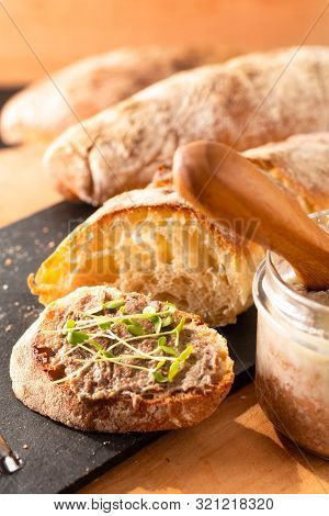Food Concept French Beefs Rillettes  Spread On Homemade Crusty Artisan Ciabatta Bread With Flax Micr