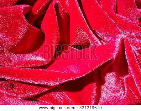 Red Velor Crumpled And Shining In The Sun
