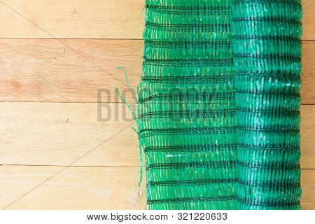 Shading Green Net Filter On Wood Plate