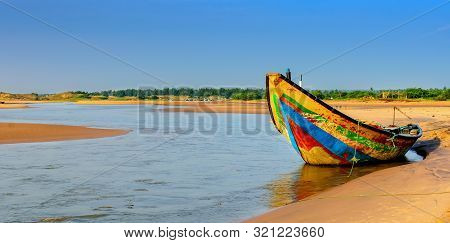 Traditional Colorful Fishing Boat Anchored At The Confluence Of Mahendra Tanaya River And Bay Of Ben