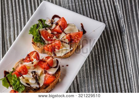 Bruschetta With Tomatoes, Lettuce, Camambert, Balsamic Vinegar