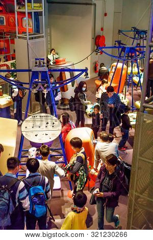 Hong Kong, China - January 20, 2016: Tourists Crowding In Hong Kong Science Museum. People Study Att