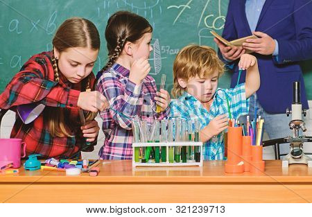 Chemistry Lab. Back To School. Happy Children Teacher. Kids In Lab Coat Learning Chemistry In School