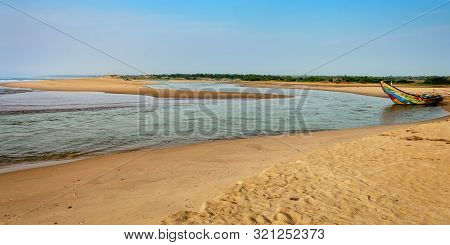 Traditional Colorful Fishing Boat Anchored At The Confluence Of Mahendra Tanaya River And Bay Of Ben