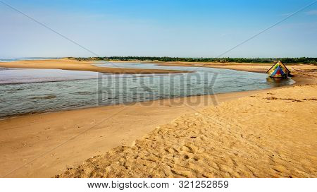 Traditional Colorful Fishing Boat Anchored At The Confluence Of Mahendra Tanaya River And Bay Of Ben