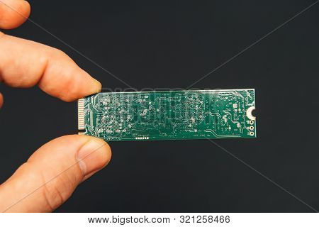 Man Hand Holding New Fast Nvm Express Non-volatile Memory Host Controller Interface Ssd Hard Disk Dr