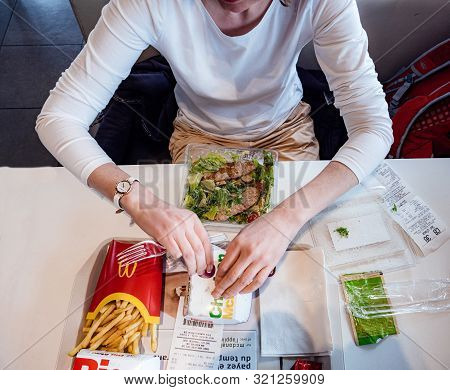 Chatte, France - Aug 11, 2017: View From Above Of Curious Impatient Woman Eating Multiple Junk Food 