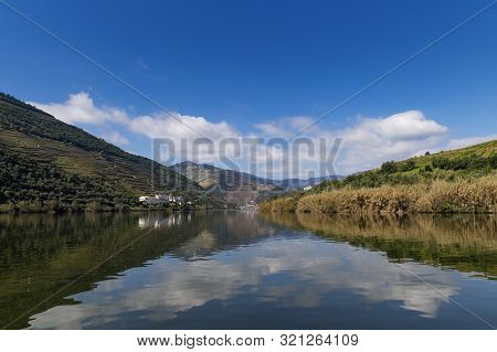 Scenic View Of The Pinhao Village With Terraced Vineyards And The Douro River And The Douro Valley, 