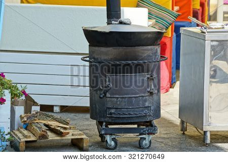One Black Iron Boiler Stands On The Street