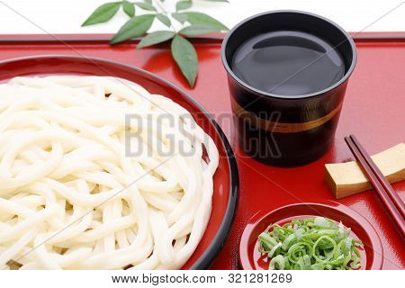 Japanese Chilled Zaru Udon Noodles In A Plate With Mentuyu On White Background