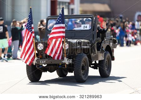 Benton Harbor, Michigan, Usa - May 4, 2019: Blossomtime Festival Grand Floral Parade, Man Driving A 