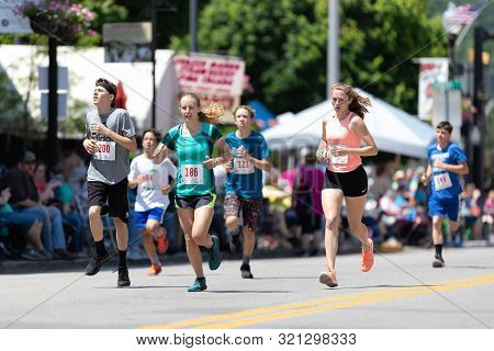 Buckhannon, West Virginia, Usa - May 18, 2019: Strawberry Festival, Young Women And Men Runing Parti
