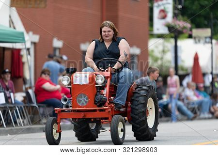 Buckhannon, West Virginia, Usa - May 18, 2019: Strawberry Festival, Old Tractors Being Driven Along 