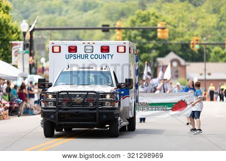 Buckhannon, West Virginia, Usa - May 18, 2019: Strawberry Festival, An Upshur County Ambulance, Goin
