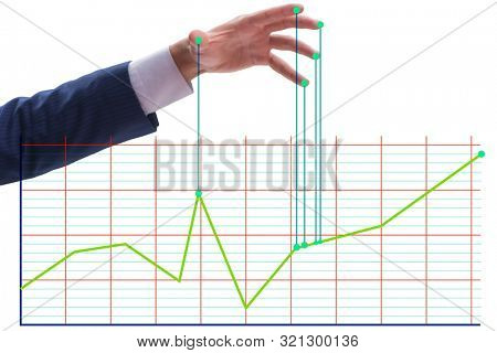 Businessman controlling the market with strings