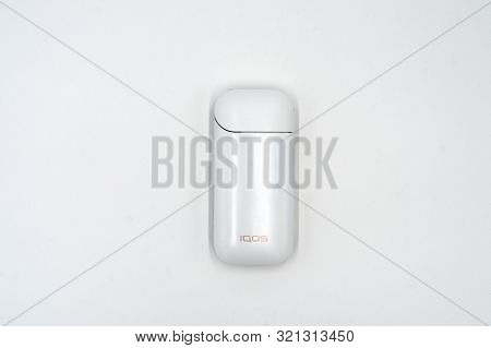White Box Iqos On A White Background. Russia, Tatarstan, September 08, 2019. White Iqos Device Batte