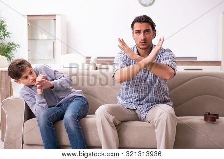 Father beating and punishing his sone