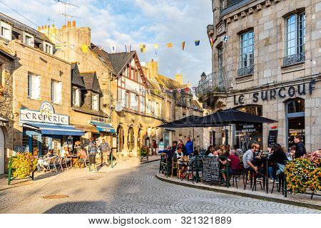 Roscoff, France - July 31, 2018: People Enjoying Dinners In Restaurants And Creperies In The Old Cen