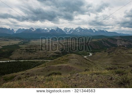 Summer in Kurai steppe and North-Chui ridge of Altai mountains, Russia. Cloud day.