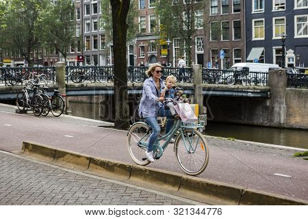 Amsterdam, Holland - July 1, 2017: Amsterdam Is One Of The Most Well Known Bicycle Friendly Cities W