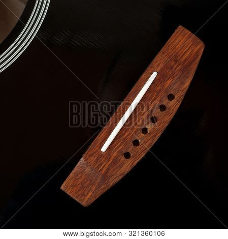 Musical Instrument - Fragment Top View Bridge Vintage Acoustic Guitar Without Strings.