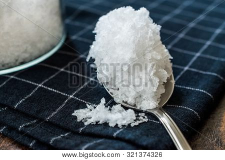 Maldon Sea Salt Flakes In Jar With Spoon.