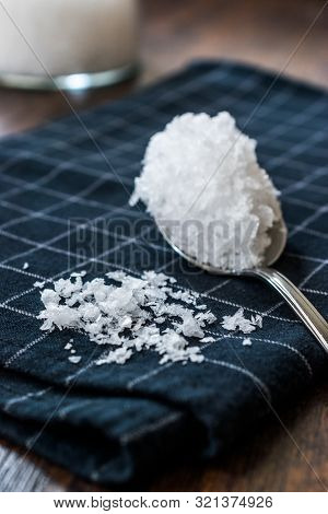 Maldon Sea Salt Flakes In Jar With Spoon.