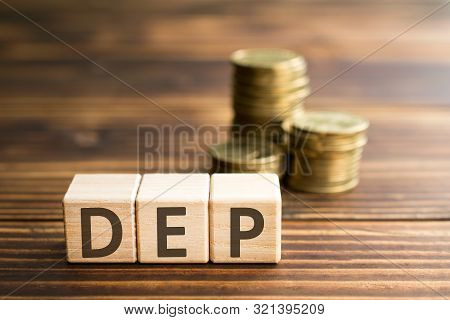 Inscription Dep Wooden Cubes With Letters, Money Piles Of Coins,  Wooden Background