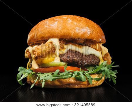 Craft Burger Is Cooking On Black Background. Consist: Sauce, Arugula, Tomato, Red Onion Rings Fries,