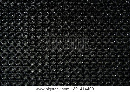 Big Stock Of Wine Bottles Laying In Wine Cellar, Bordeaux Winery, France