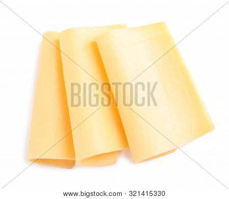 Slices Of Tasty Cheese On White Background, Top View