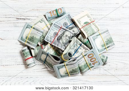 Us Dollar Bills Bundles Stack. One Hundred Dollar Bills With Stack Of Money In The Middle. Top View 