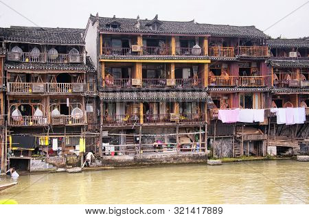 Fenghuang, China.  September 13, 2015.  Chinese Guest Houses And Balconies On The Banks Of The Tuo J
