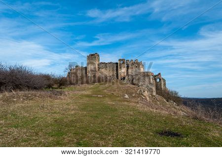 A View Of Soimos Fortress With A Blue Sky In The Background. Built In 1278