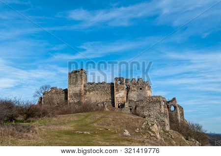 A View Of Soimos Fortress With A Blue Sky In The Background. Built In 1278