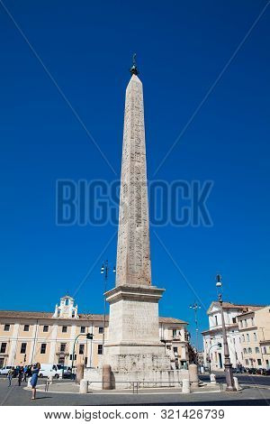 Rome, Italy - April, 2018: Tourists Visiting The Lateran Obelisk An Ancient Egyptian Obelisk Built O