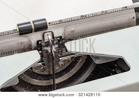 Carriage With Letters In A Mechanical Typewriter. Letter Pressed