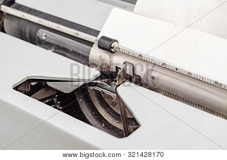 Carriage With Letters In A Mechanical Typewriter. Letter Pressed