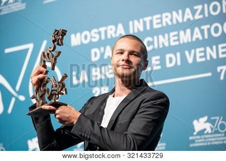 Toby Wallace poses with the Marcello Mastroianni Award for Best Young Actor for 