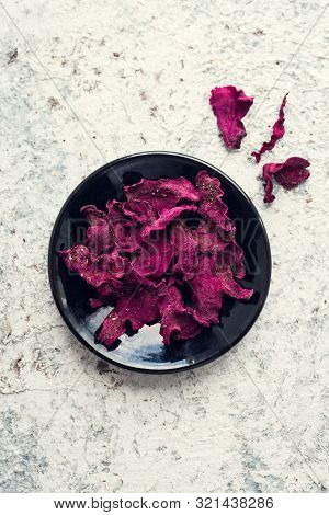 Healthy Homemade Vegetable Chips From Beetroot With Salt, Pepper And Origano On Black Background. Or