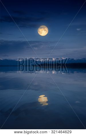 An image of the Starnberg Lake by night with full moon near Tutzing Bavaria Germany