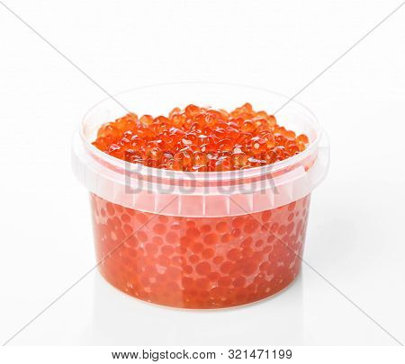 Plastic Container With Red Salmon Or Keta Fish Caviar On White Background. Sea Food. Healthy Eating