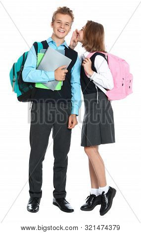 Pupils In School Uniform Gossiping On White Background