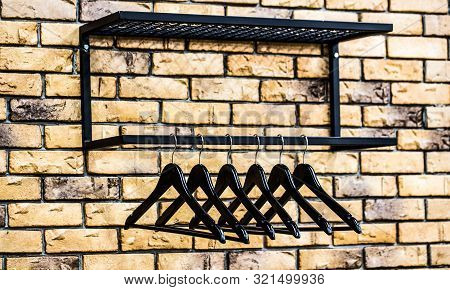 Store Concept, Sale, Design, Empty Hangers. Black Friday. Wooden Coat Hanger Clothes. Fashionable Di