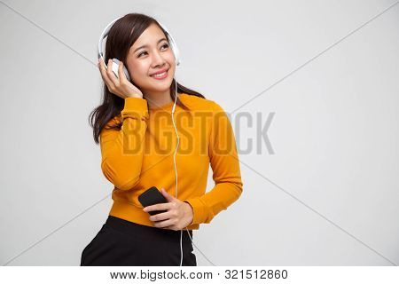 Young Asian Beauty Woman Listening Music With Headphones In Playlist Song Application On Smartphone 