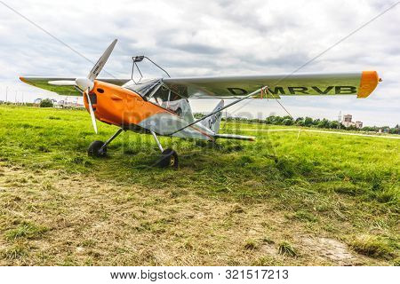 KALININGRAD, Russia - August 18, 2019: 100 Anniversary First European Airport Devau Fest, Ultra Light Propeller Screw Plane Ready for Flight